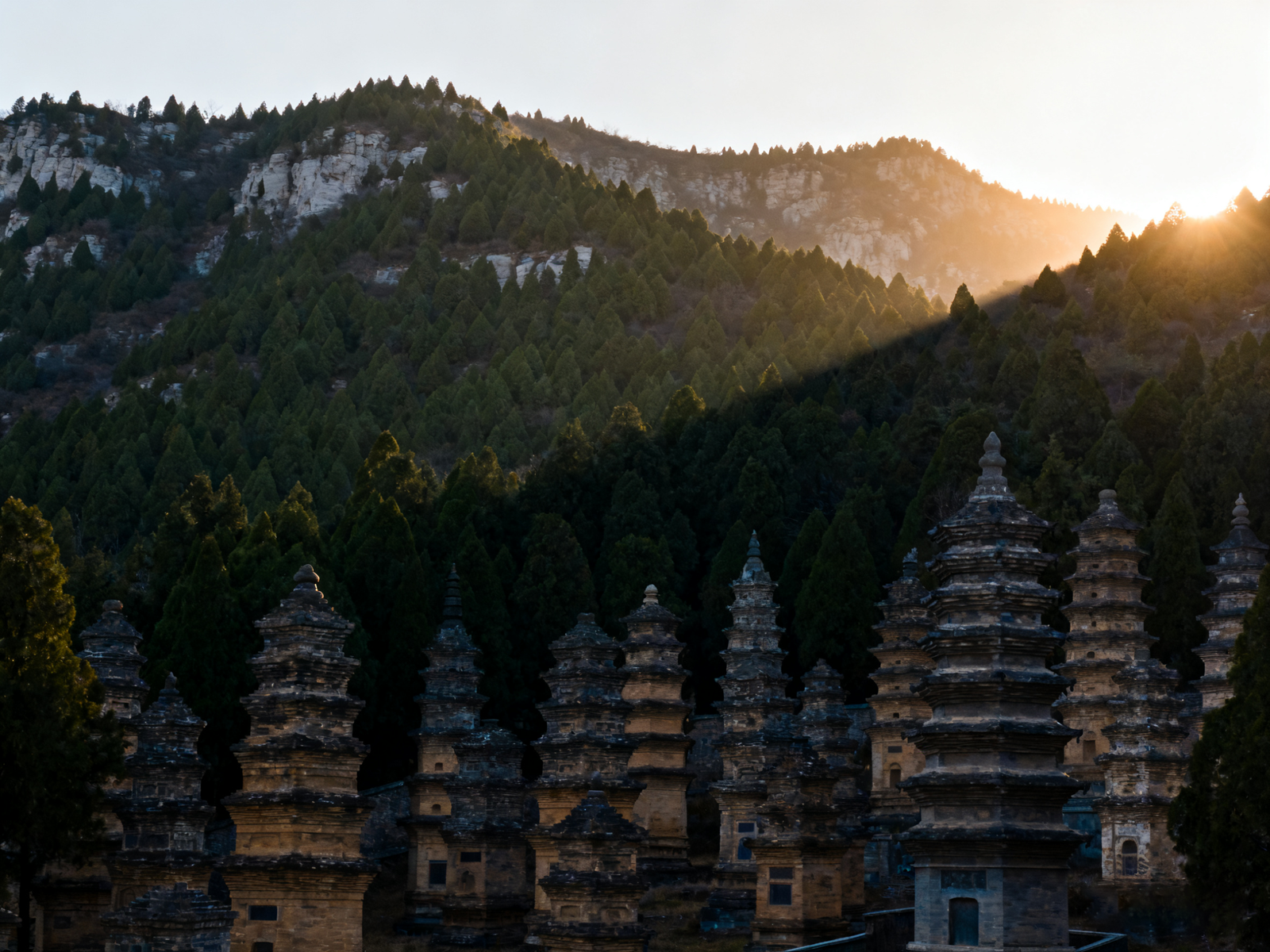 Pagoda Forest and academy courtyards beneath Mount Song; stone and practice share the same courtyards.